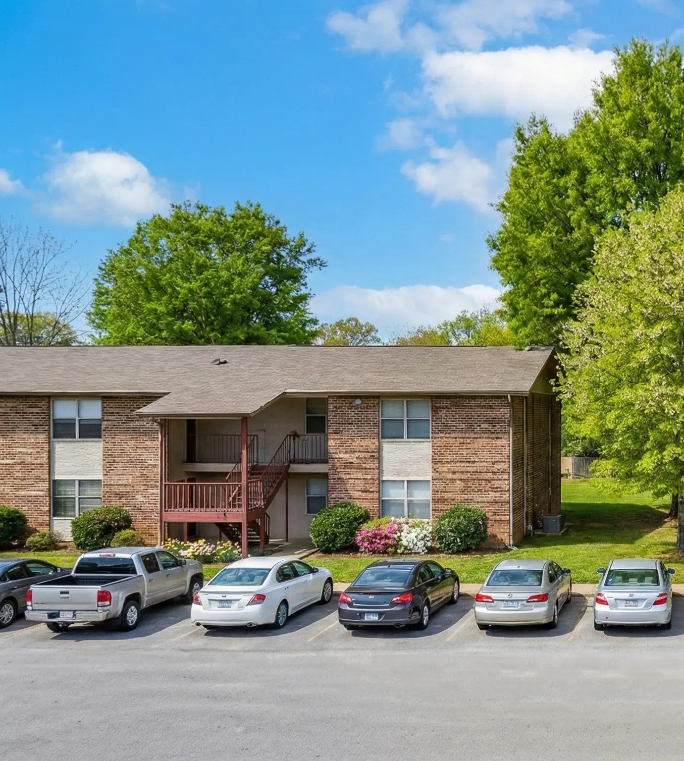 Tree-lined entrance to Robindale East Apartments